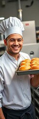 Smiling baker with tray of fresh pastries at factory workstation,  delicious,  wholesome
