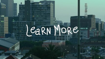 Animation of learn more text banner against aerial view of cityscape - Powered by Adobe