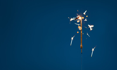 1 year celebration festive background with copy space made with Bengal fires in the form of number One.