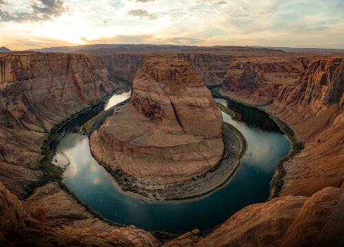A breathtaking view of Horseshoe Bend, where the Colorado River curves dramatically around towering sandstone cliffs in Page, Arizona.