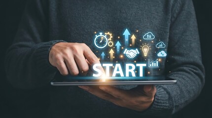 A person holding a tablet with a start button and various icons