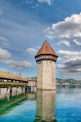Lucerne, a compact Swiss city known for its well-preserved medieval architecture, is located amidst the snow-capped mountains of Lake Lucerne.