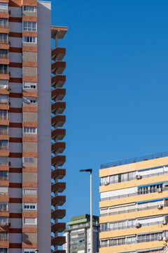 benidorm spain urban tower highrise facade with apartment residential skyline under open sky in vintage documentary architecture travel view