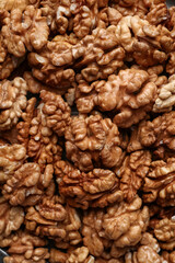 Tasty shelled walnuts as background