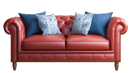 Luxury red leather tufted sofa with decorative blue and white pillows classic living room furniture isolated on white background