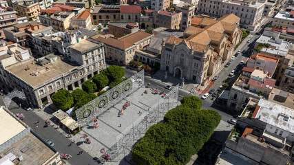 Fototapeta premium Aerial view of Reggio Calabria Cathedral, in Italy. It is a Roman Catholic cathedral in the historic center of the city. Its dedication is to the Assumption of the Virgin Mary. It is a sunny morning.