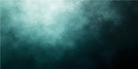 Obraz premium A dark blue grunge background features a textured blend of smoke and misty clouds swirling through a stormy night sky with subtle light patterns and motion