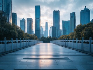 A long stone bridge with an impressive city skyline in the background during sunset.