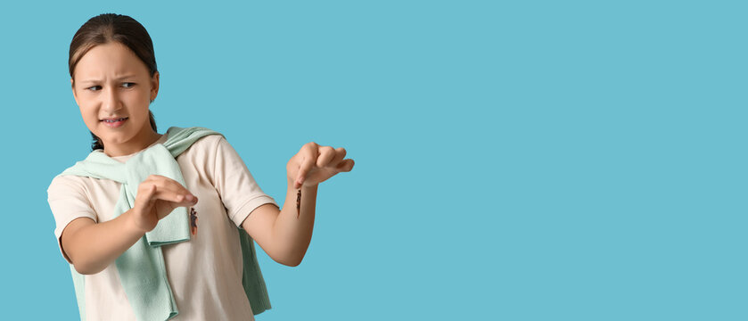 Scared girl with cockroaches on blue background with space for text