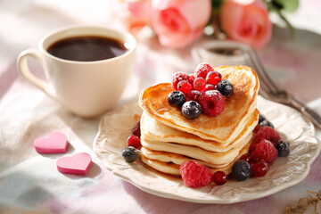 Valentine's morning breakfast with heart-shaped pancakes, berries, coffee cup, pastel tablecloth, morning sunlight, cozy inviting lifestyle imagery