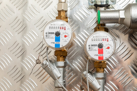 Household water meters in an apartment building. Close-up, selective focus. Water meters. Counters of hot and cold water