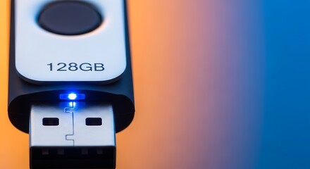 Fototapeta premium Closeup of a 128gb usb flash drive with blue light on colorful background