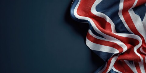 A close-up of a flag, draped, with red, white, and blue stripes. Navy blue background