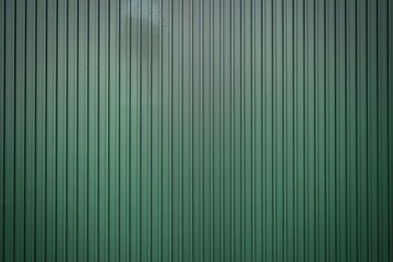 a vertical green metal surface