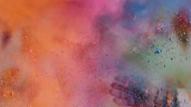 Vibrant Holi Festival celebration video background with joyful people throwing colorful powders in a Connectioneering atmosphere with warm, lively tones and a shallow depth of field.