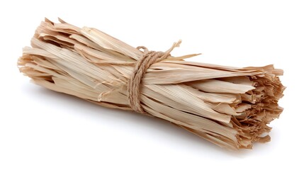 A bundle of dried and tied grass or straw on a white background.