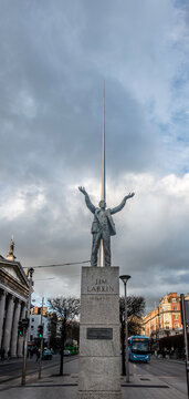 The Jim Larkin statue on O'Connell Street in Dublin commemorates the trade union leader of the 1913 Lockout, with the Spire rising in the background.
