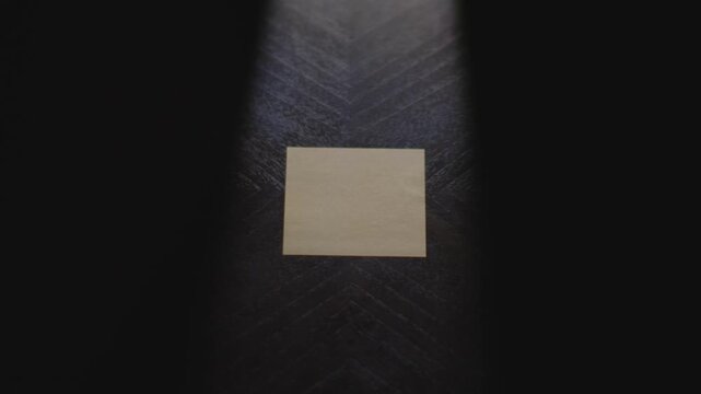 "Virgo" written on a Sticky Note with a sharpie and placed on a table under dramatic lighting