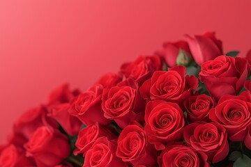 Fototapeta premium Vibrant bouquet of red roses arranged beautifully against a soft red background, showcasing the lush petals and green leaves in a romantic floral display for special occasions
