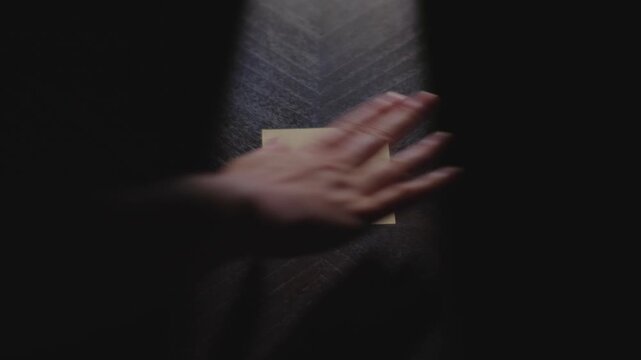 Q3 written on a Sticky Note with a sharpie and placed on a table under dramatic lighting