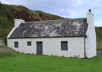 Traditional salmon bothy, or fisherman's cottage, located at Dunbeath Harbour in the Scottish Highlands

