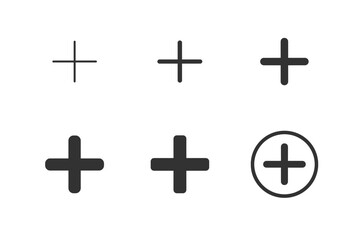 Collection of plus symbols in various styles and thicknesses on a white background