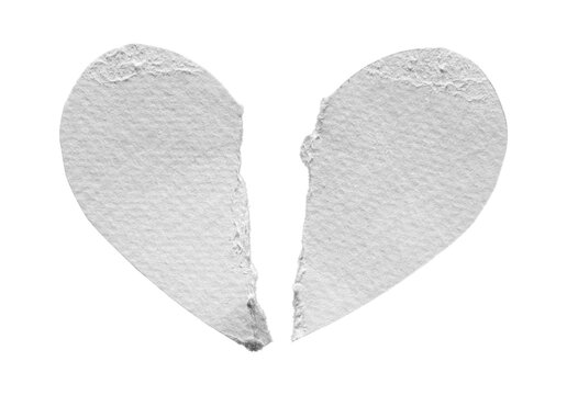 Torn white paper heart broken into two pieces, isolated on transparent background.