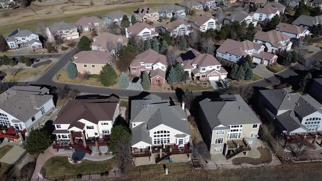 Residences along South Zeno Way and adjacent loops form rhythmic cul-de-sac pattern with landscaped yards. Gabled roofs, leafless trees, and large multistory suburban homes, Aurora, Colorado