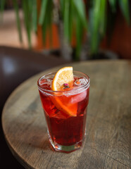 glass of summer red cocktails in cafe table menu  