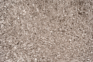 Shiny silver foil background. Top view.