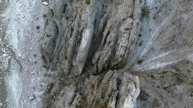 Aerial drone footage over the Susaibes stream near Andreis, Italy: clear water, rocky bed and pristine alpine surroundings. Ideal for nature, travel and scenic stock footage.
