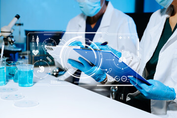 Senior medical scientists working in laboratory, reviewing research data and experiment results, reflecting healthcare, science, teamwork