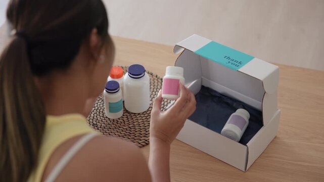 Young asia people woman buy custom tailor made anti aging pill bottle diet immune plan online health care shop open gift box weight loss herbal. Unbox order store clinic home service life balance.