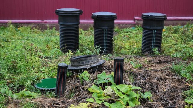 Septic tank system installation with pipes in backyard for wastewater management