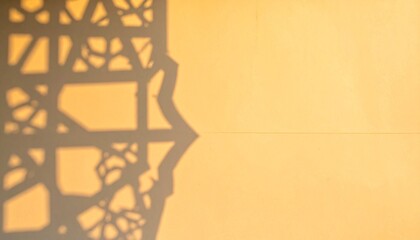 Intricate islamic pattern shadow on wall with copy space