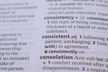 English Dictionary Book Page Close Up With The Word Transcription Of -consistent