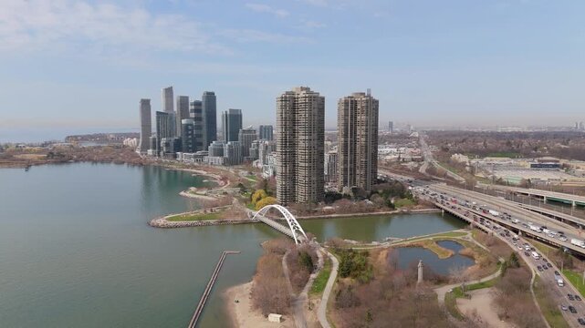 Aerial Flyover Of Parklawn Neighbourhood With Condo Buildings And Gardiner Expressway In Toronto, Canada.