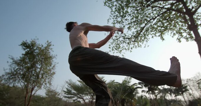 Dynamic time ramp showcases athletic power and precision. The footage shifts speed during a complex corkscrew backflip at sunset, highlighting elite body control. Concept: sport, fitness, power, skill