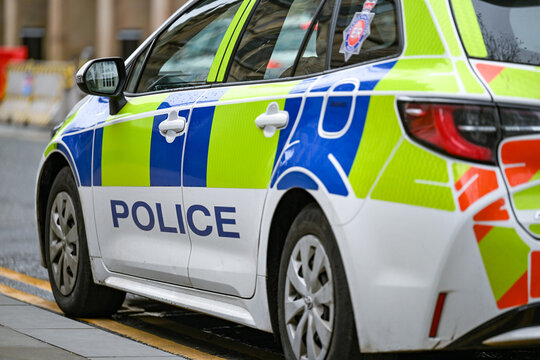 Greater Manchester Police emergency response cars parked outside Manchester town hall in the city centre. 