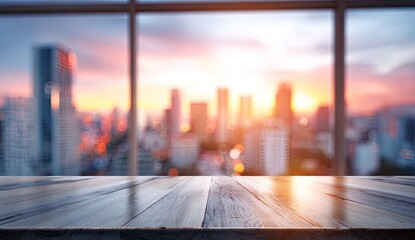 Wooden table in foreground with blurred city skyline at sunset