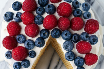 Light Honey Biscuit Cake with White Protein Cream and Fresh Berries, Close Up, top view