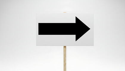 Clear sign with a bold black arrow pointing to the right, mounted on a wooden post, indicating direction.