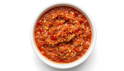 Spicy red sambal paste in a white bowl, made with chilies, onions, and spices, perfect for Asian cuisine.