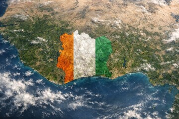 Aerial view of C&ocirc;te d'Ivoire with the national flag's colors overlaying the landscape, symbolizing national pride.