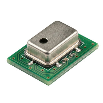 MEMS microphone component on green circuit board. Electronic sensor module.