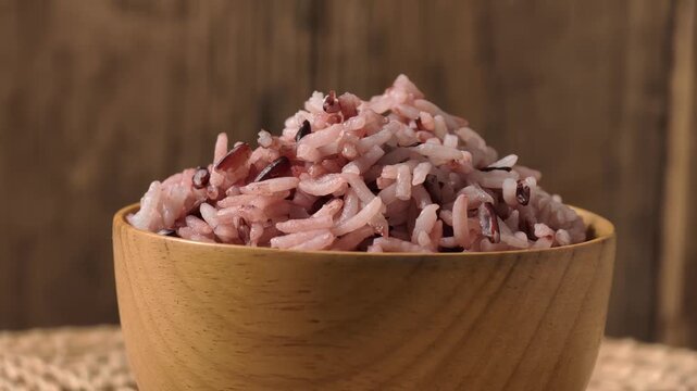 Wooden bowl filled with riceberry 