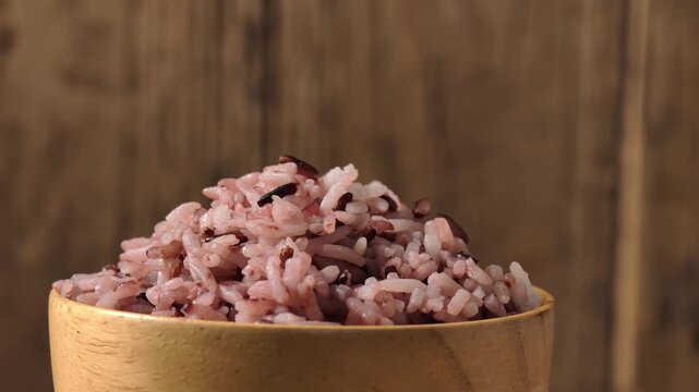 Wooden bowl filled with riceberry 