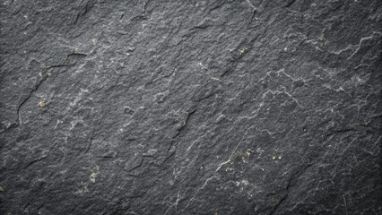 Dark stone texture with natural lines and patterns in close view on a surface