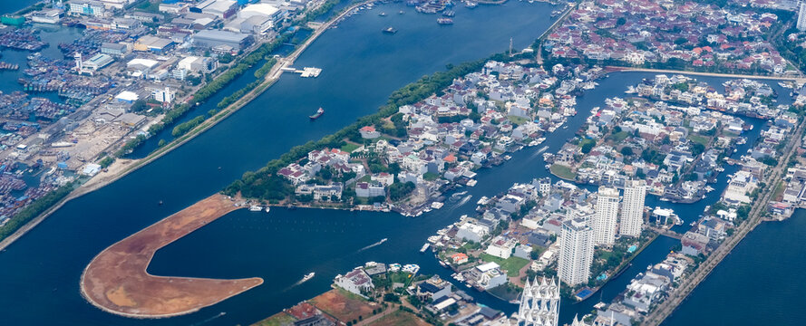 Dense coastal sprawl of North Jakarta shows extreme urban density pressed against the sea, a vulnerable low-lying landscape facing rapid land subsidence and rising tidal risks.