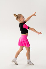 Young dancer with cochlear implant performing expressive sport dance movement. Hearing loss rehabilitation, auditory therapy, assistive technology, physical coordination, and confidence growth